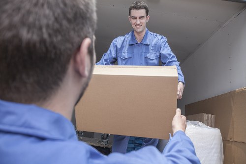 Professional packers organizing items for a move in Storage Acton
