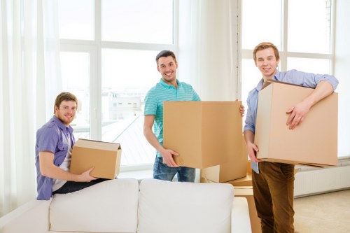 Unpacking and arranging furniture in a new home in Storage Acton
